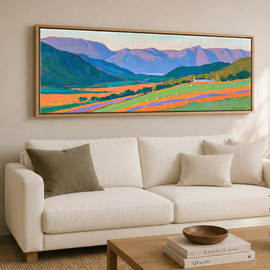 Vibrant Valley Below Purple Fells Lake District Valley panoramic canvas wall art displayed above a sofa