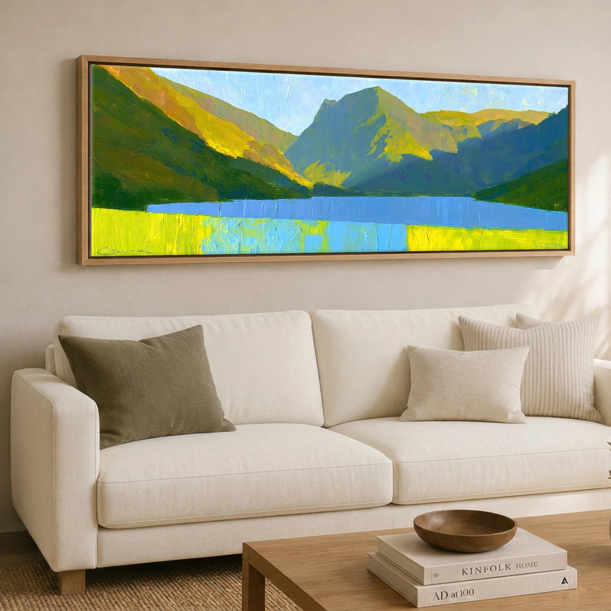 Luminous Fells Over Sapphire Water Lake District Lake panoramic canvas wall art displayed above a sofa