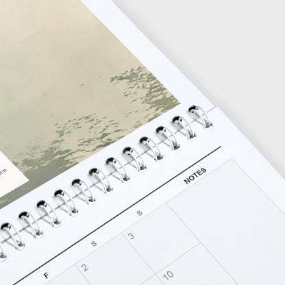 Phillip Marbury 2027 wall calendar hanging in a corner