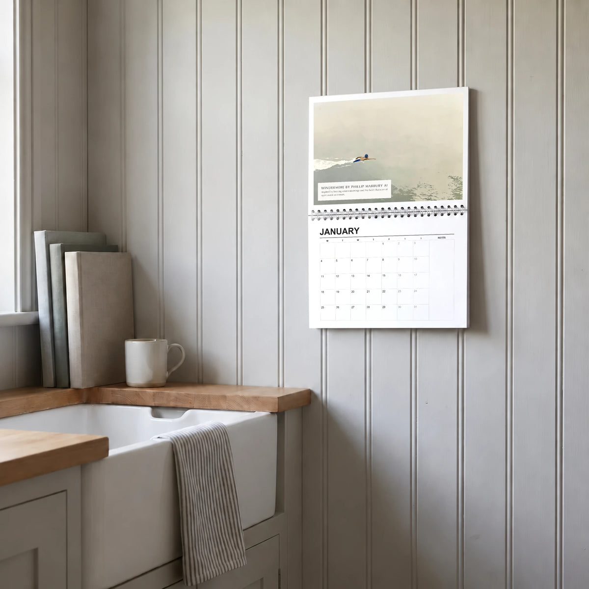 Phillip Marbury 2027 wall calendar hanging in a utility room