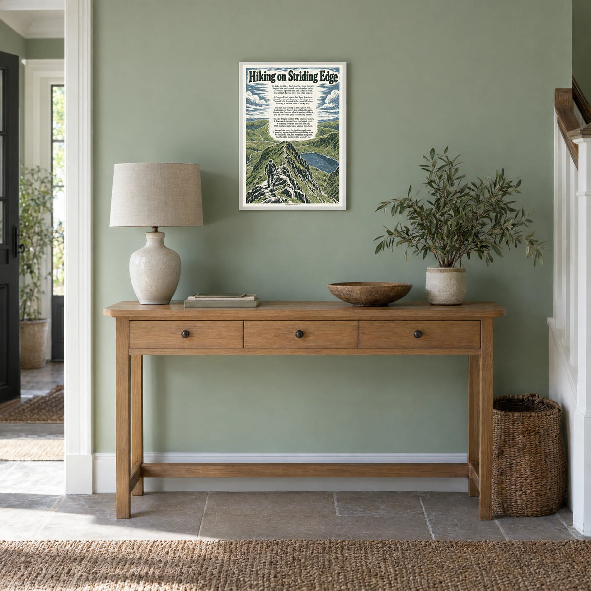 Hiking on Striding Edge poem print at A3 size, in a white frame, hanging in a hallway