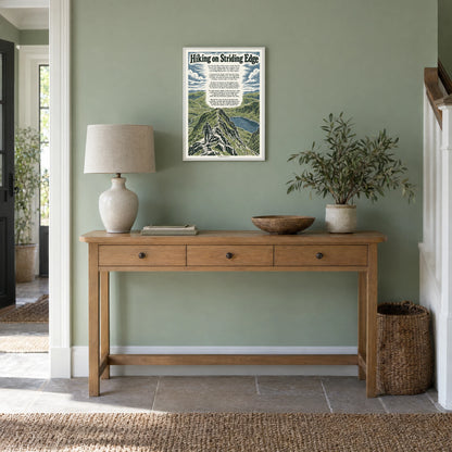 Hiking on Striding Edge poem print at A3 size, in a white frame, hanging in a hallway