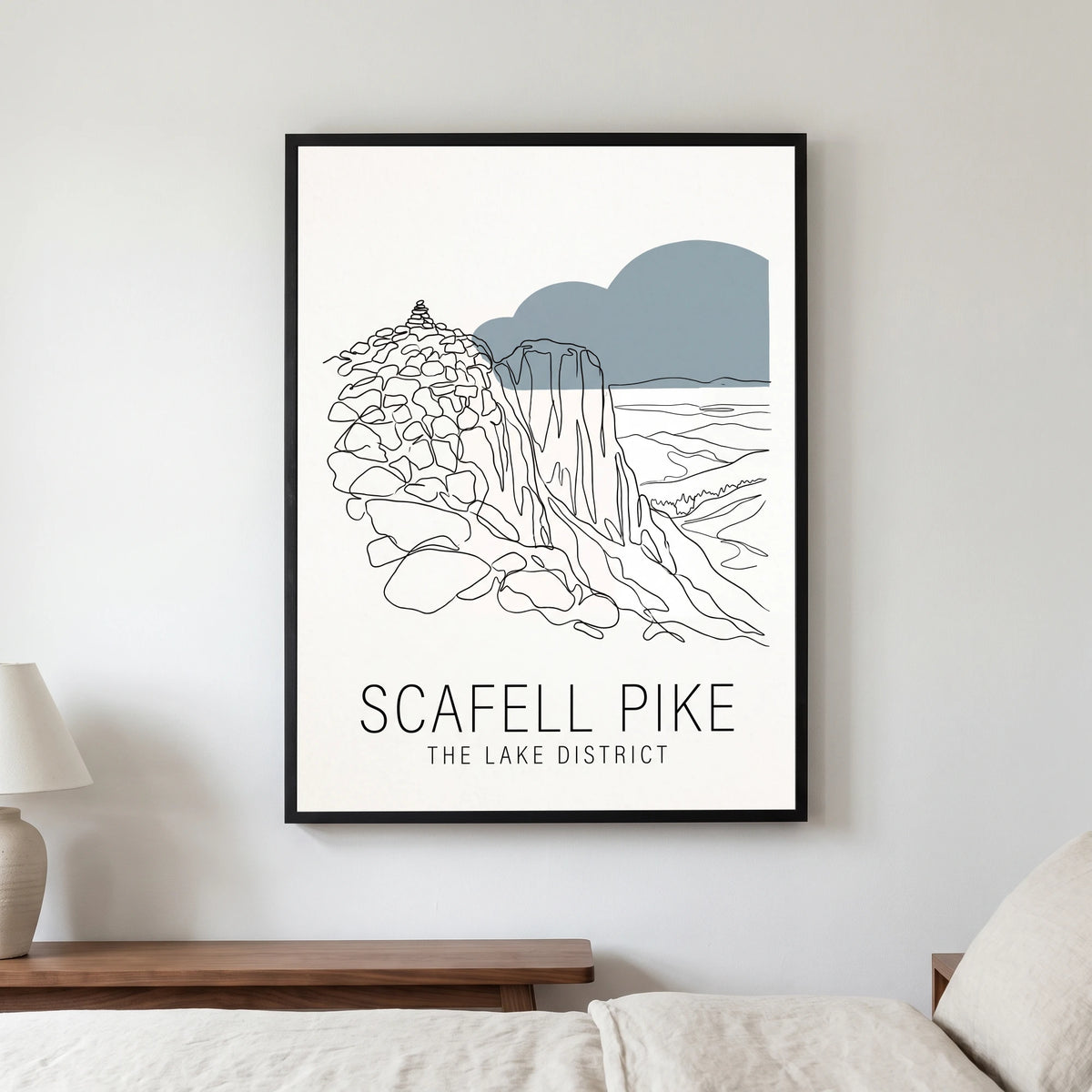 Scafell Pike travel poster in a black frame, hanging in a bedroom3