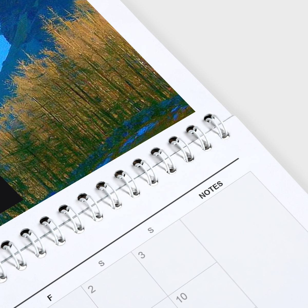 Selected Artists 2027 wall calendar hanging in a corner