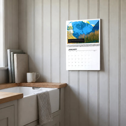 Selected Artists 2027 wall calendar hanging in a utility room