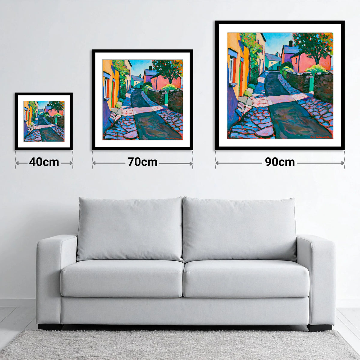 Vibrant Cobbled Village Street - size guide showing 40cm, 70cm and 90cm art prints