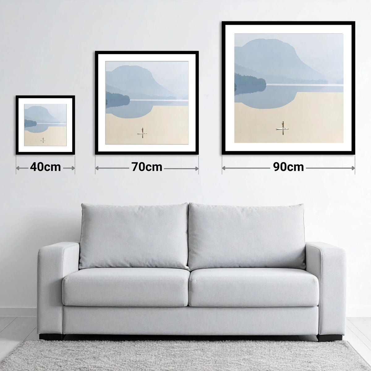 Paddleboarding Under Misty Blue Fells - size guide showing 40cm, 70cm and 90cm art prints