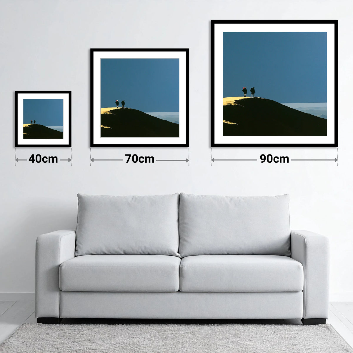 Silhouetted Hikers on a Fell Top - size guide showing 40cm, 70cm and 90cm art prints