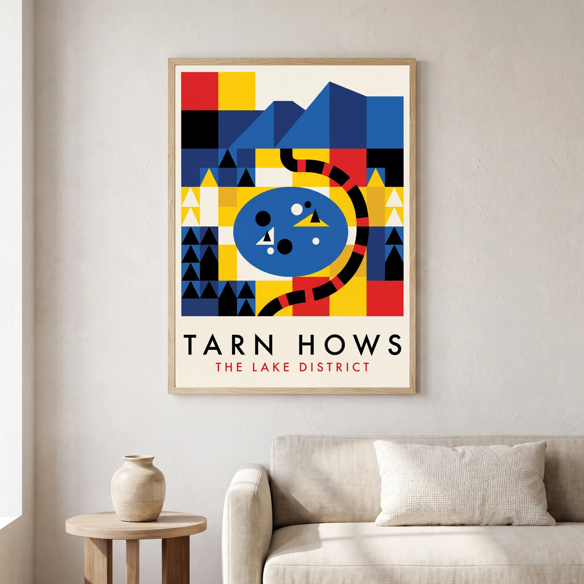 Tarn Hows travel poster in a natural frame, hanging in a living