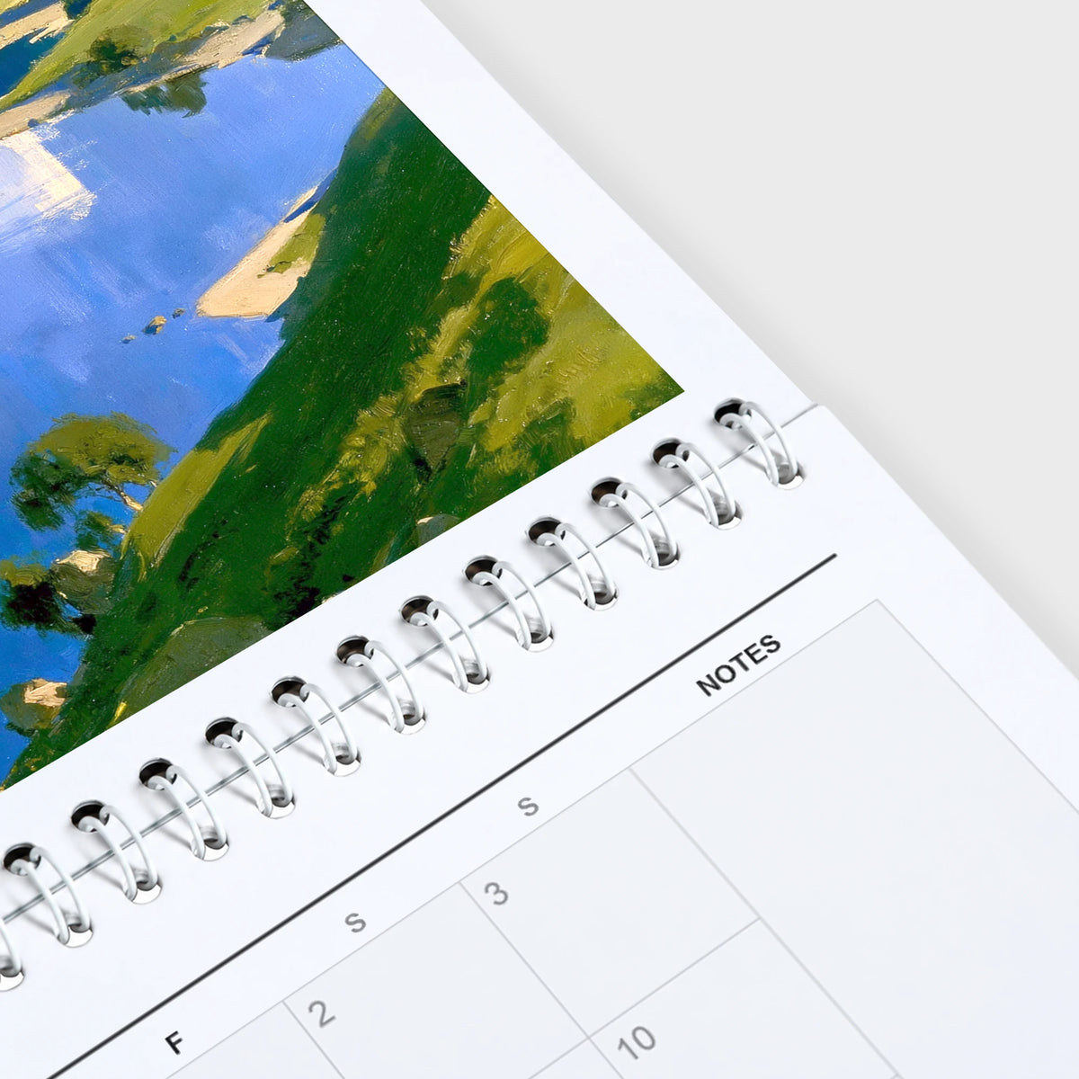 The Lakes 2027 wall calendar hanging in a corner