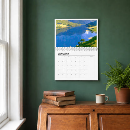 The Lakes 2027 wall calendar hanging in a study