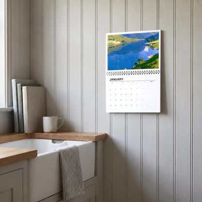 The Lakes 2027 wall calendar hanging in a utility room