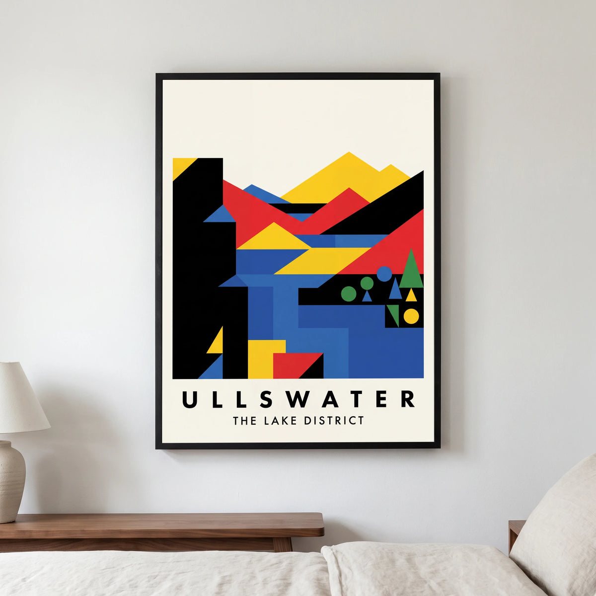 Ullswater travel poster in a black frame, hanging in a bedroom3