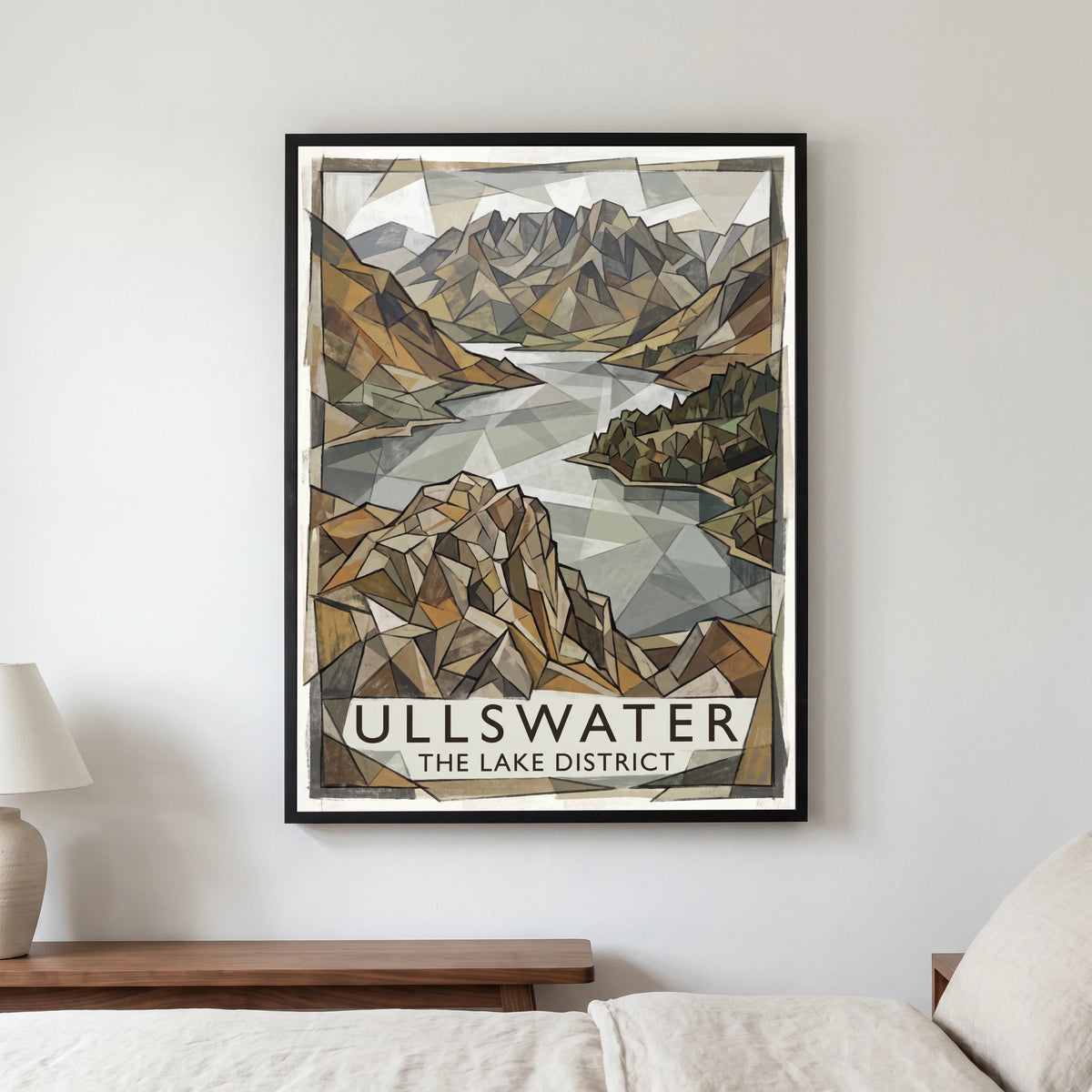 Ullswater travel poster in a black frame, hanging in a bedroom3