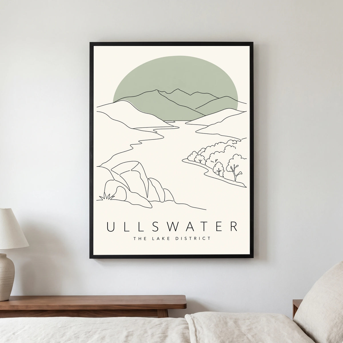 Ullswater travel poster in a black frame, hanging in a bedroom3