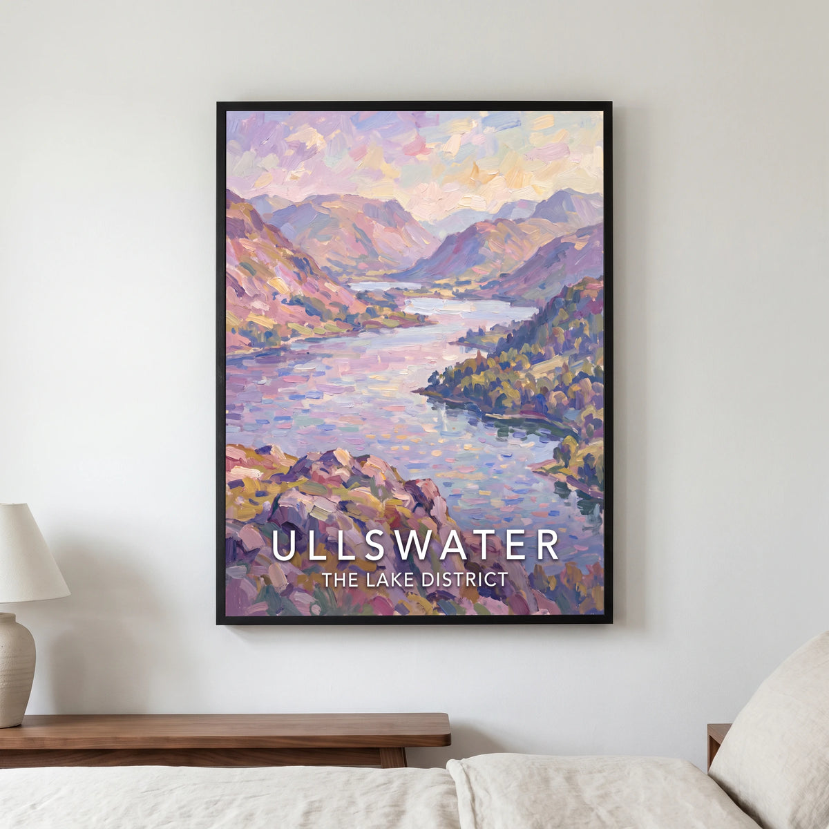 Ullswater travel poster in a black frame, hanging in a bedroom3