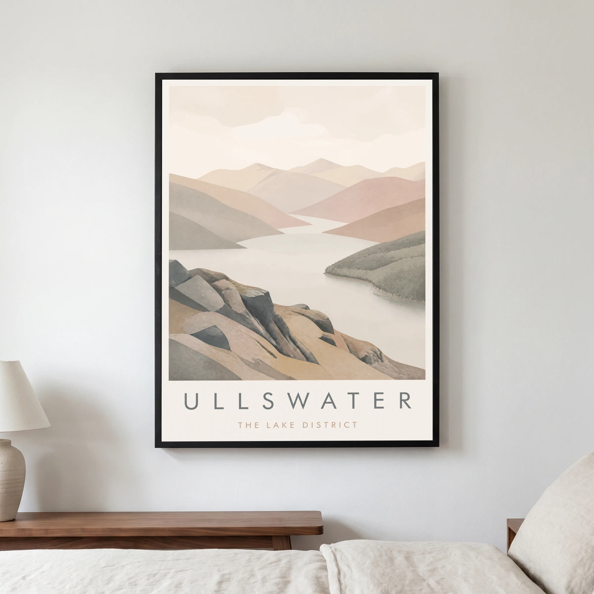 Ullswater travel poster in a black frame, hanging in a bedroom3