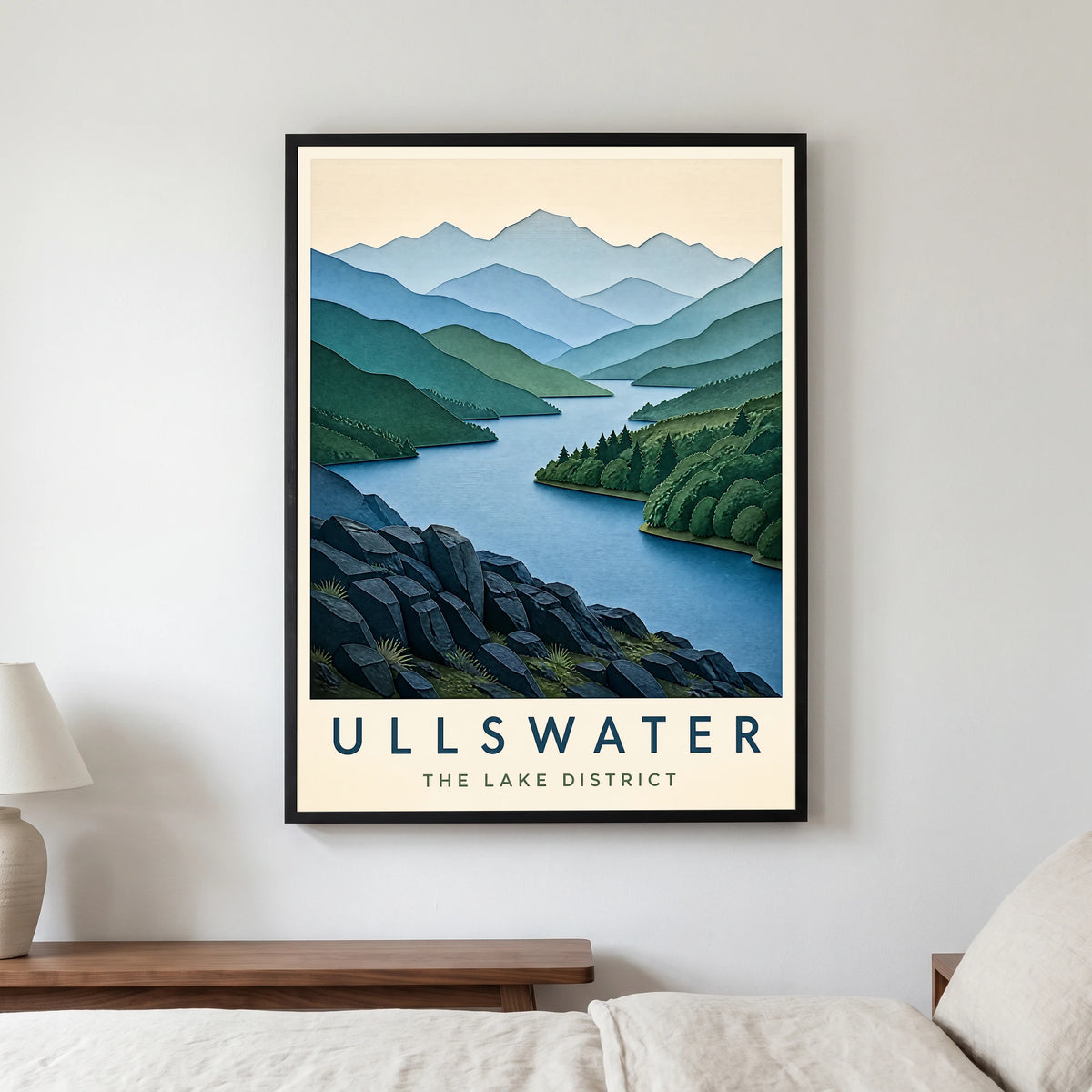 Ullswater travel poster in a black frame, hanging in a bedroom3