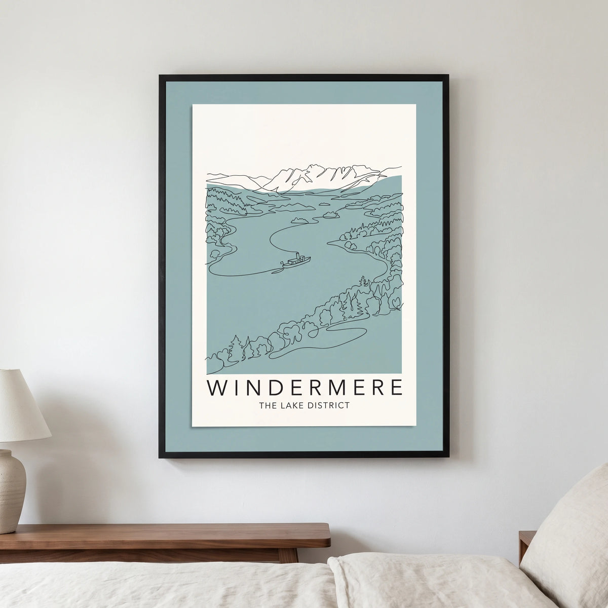 Windermere travel poster in a black frame, hanging in a bedroom3